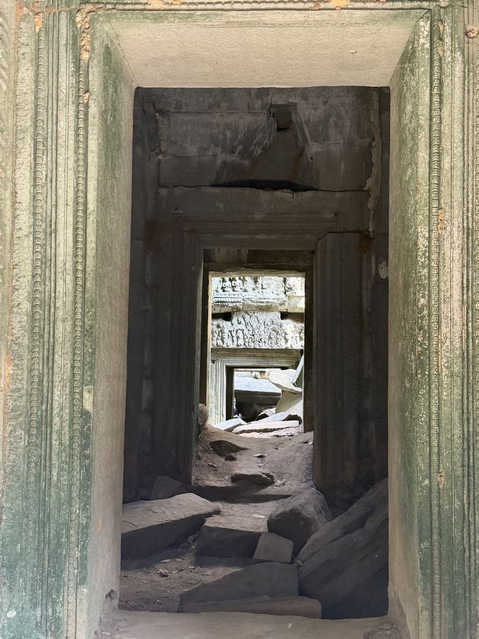 A line of stone doorways leading deep into a temple