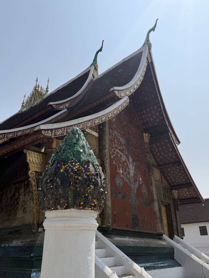 A temple with sweeping layered roofs and mosaic walls