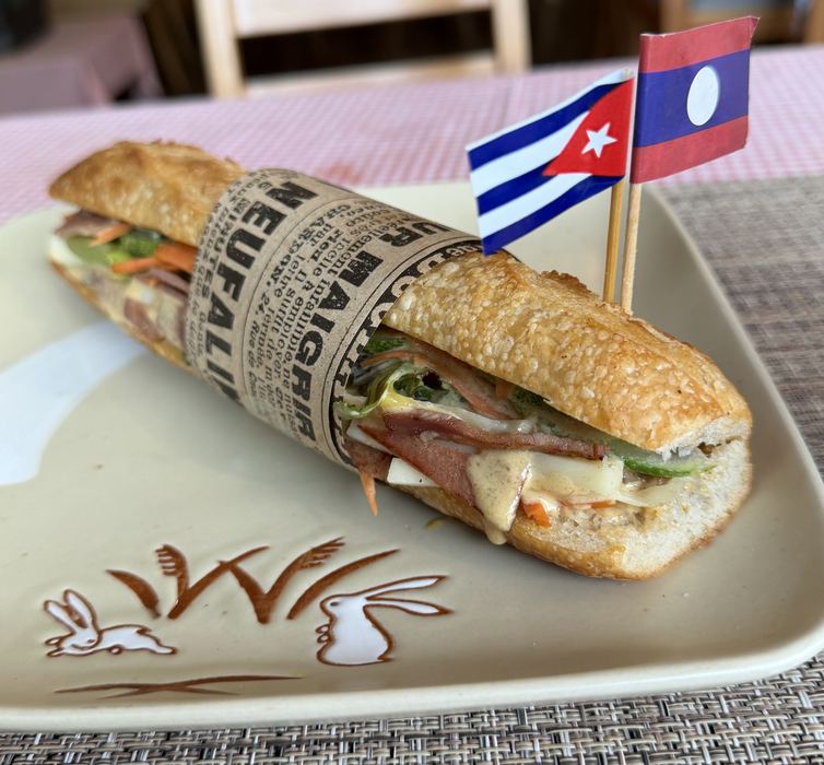 A Cuban sandwich with Cuban and Lao flag toothpicks