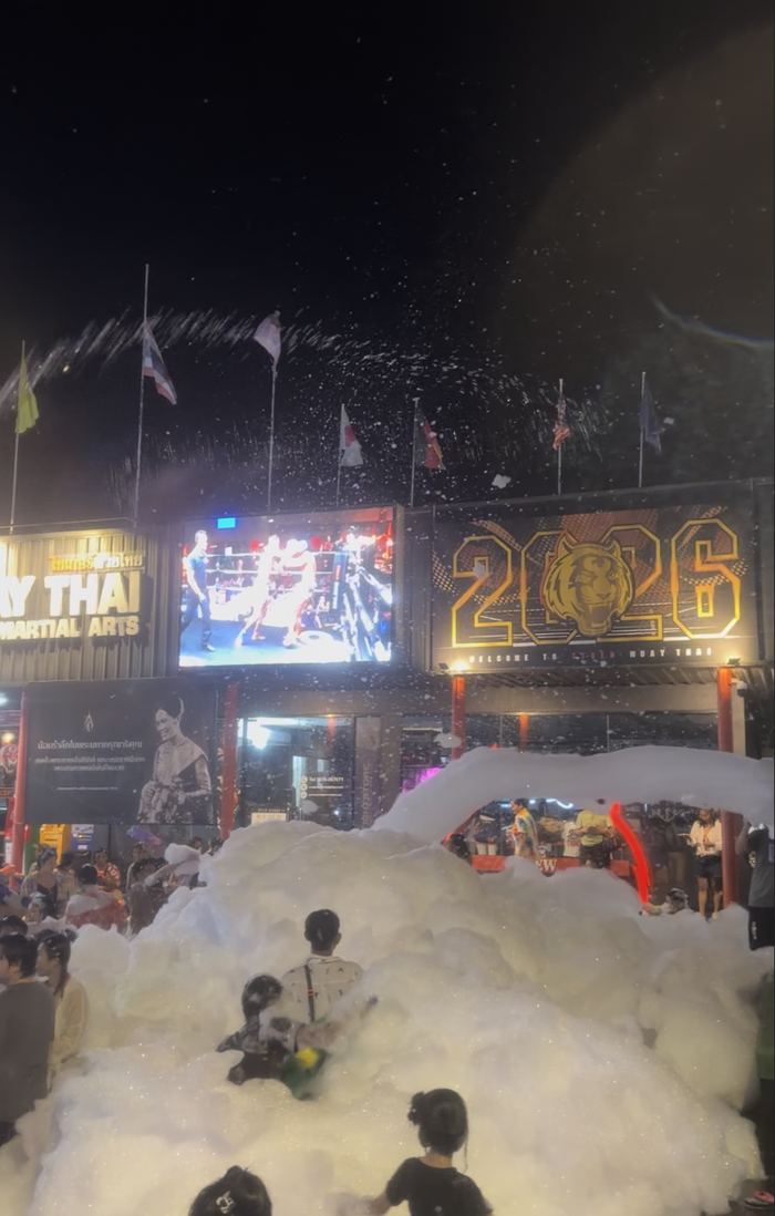 A foam party at night during Songkran