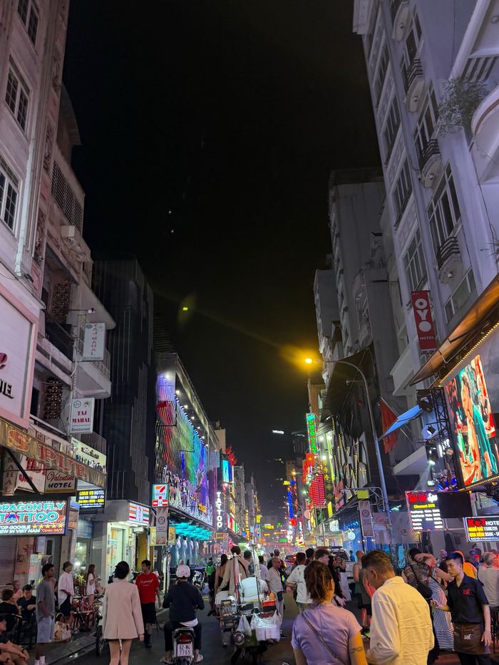 Crowds and neon signs on Bui Vien Street at night