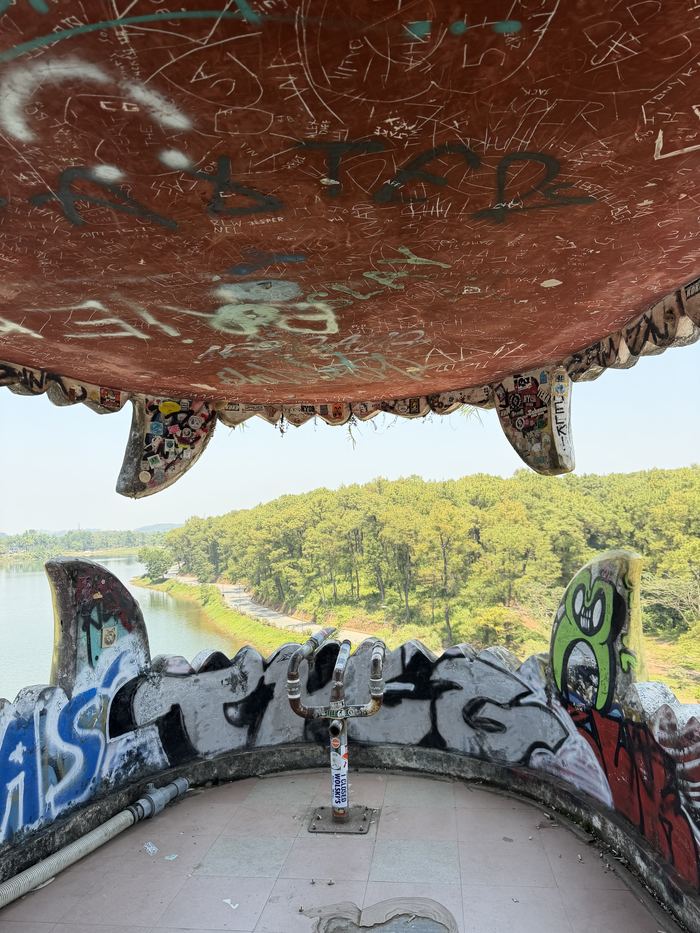 Looking out at the lake from inside the dragon's graffiti-covered mouth