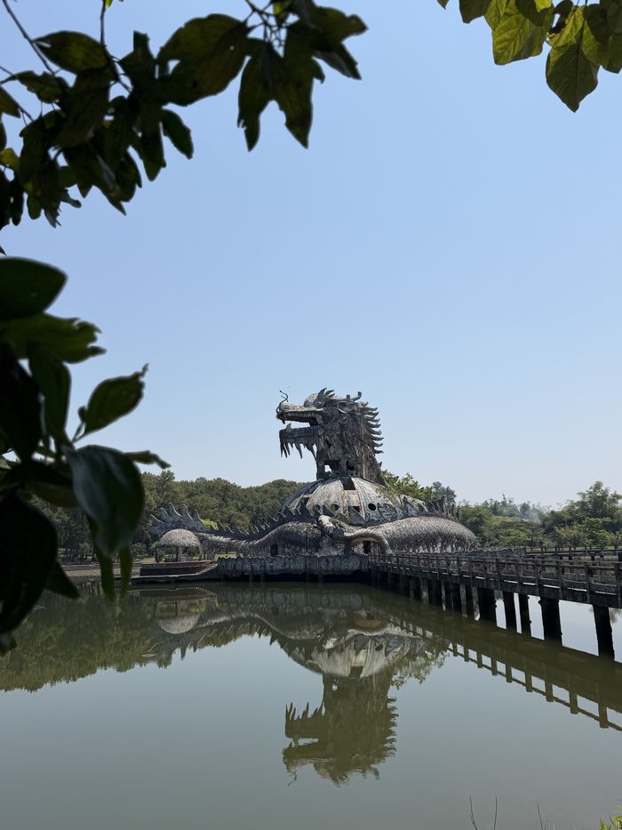 The abandoned dragon building reflected in a lake